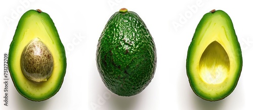 A ripe avocado has been sliced in half and placed on a clean white surface. The creamy green flesh contrasts with the stark background, showcasing its freshness.