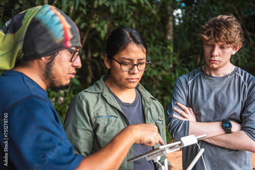 People flying drone in nature