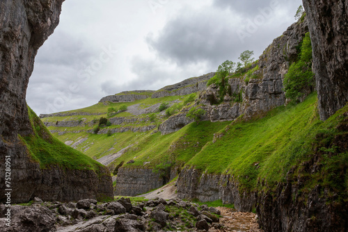 The entrance to the awesome hidden Gordale Scar, popular with rock climbers, Yorkshire Dales National Park, North Yorkshire, England, UK