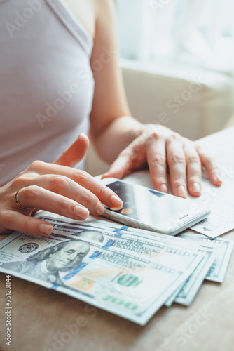 close up of entrepreneur woman pay bills taxes online photo