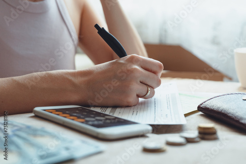 Financial Management: Woman Handling Expenses, Savings, Bill, Receipts photo