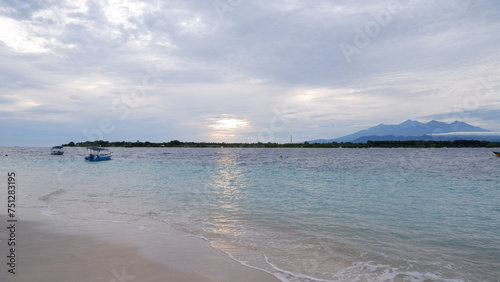 View of islands and mountains from Gili Trawangan Beach at sunrise, Indonesia