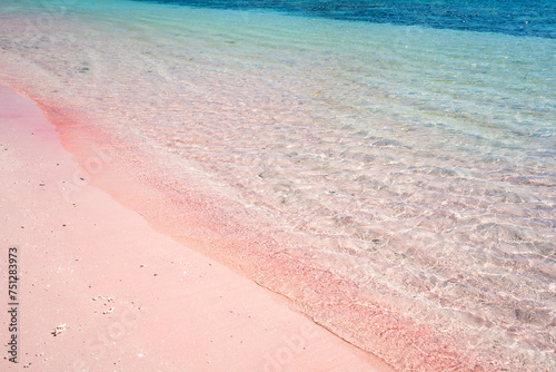 Tropical pink sandy beach with clear turquoise water at Komodo islands in Indonesia