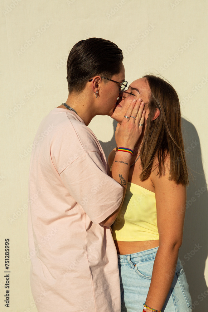 Lesbian couple share a kiss Lesbian couple share a kiss