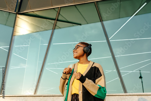 Smiling young woman listening to music