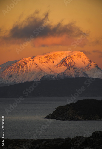 Dramatic light and clouds over mountain peaks around Tromso northern n photo