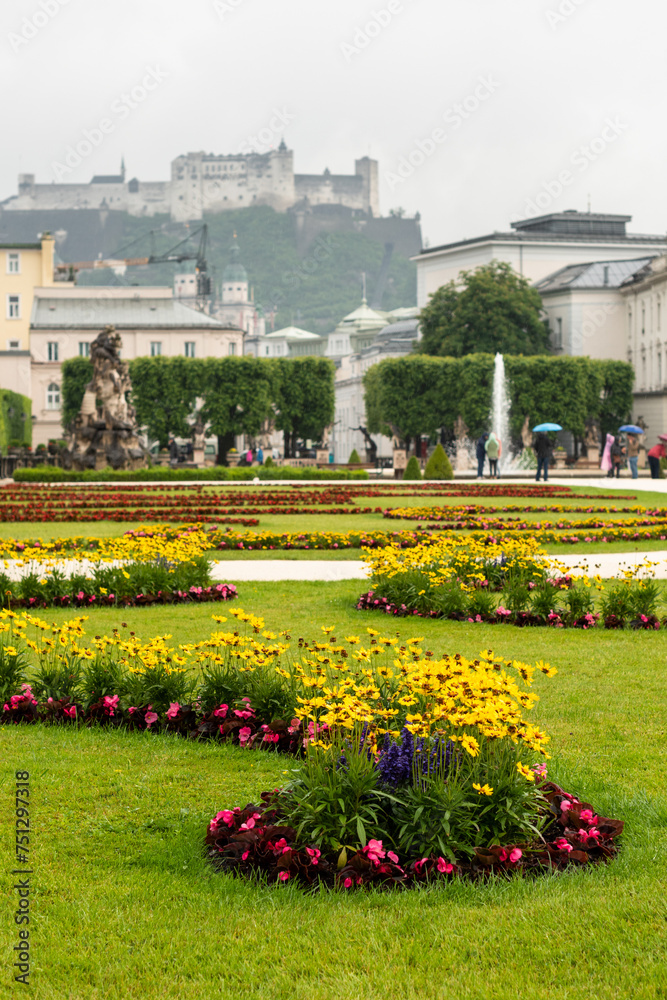Blooming flowers in Mirabell Gardens in Salzburg in the early summer sunny day