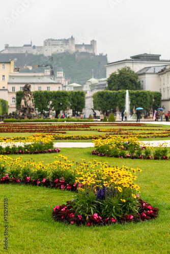 Blooming flowers in Mirabell Gardens in Salzburg in the early summer sunny day © Simona Machackova