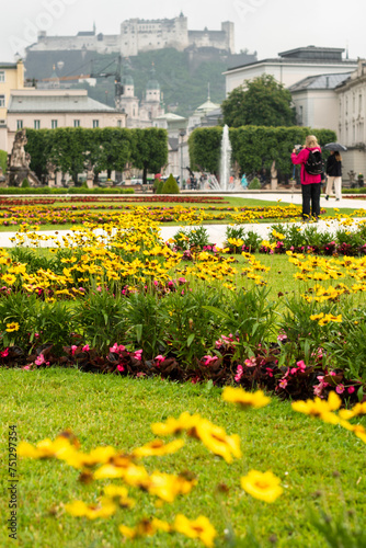 Blooming flowers in Mirabell Gardens in Salzburg in the early summer sunny day