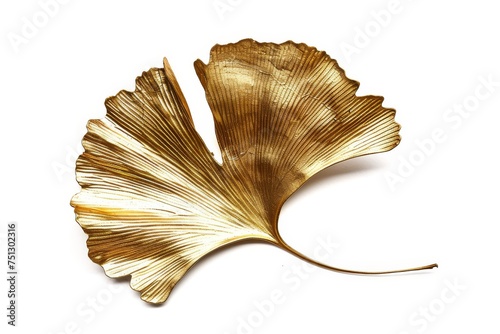 ornamental piece resembling a ginkgo biloba leaf, its golden hue capturing the natural elegance of a real leaf