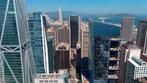 Downtown san francisco with clear blue sky, modern skyscrapers, and distant bay views, midday, aerial view