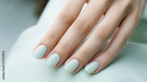 Glamour woman hand with mint green nail polish on her fingernails. Green nail manicure with gel polish at luxury beauty salon. Nail art and design. Female hand model. French manicure. Generative AI.