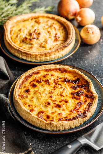 Traditional french pie. Quiche lorraine on kitchen table.