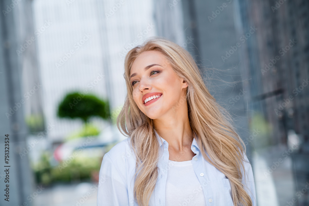 Fototapeta premium Photo of cheerful adorable pretty woman walking on street sunny warm spring day outdoors