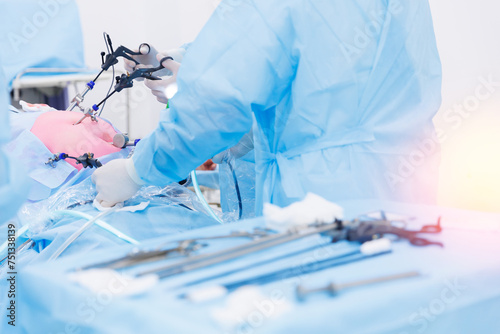 Operation process on abdominal, blue light. Modern laparoscopic equipment, doctor surgery working, sunlight