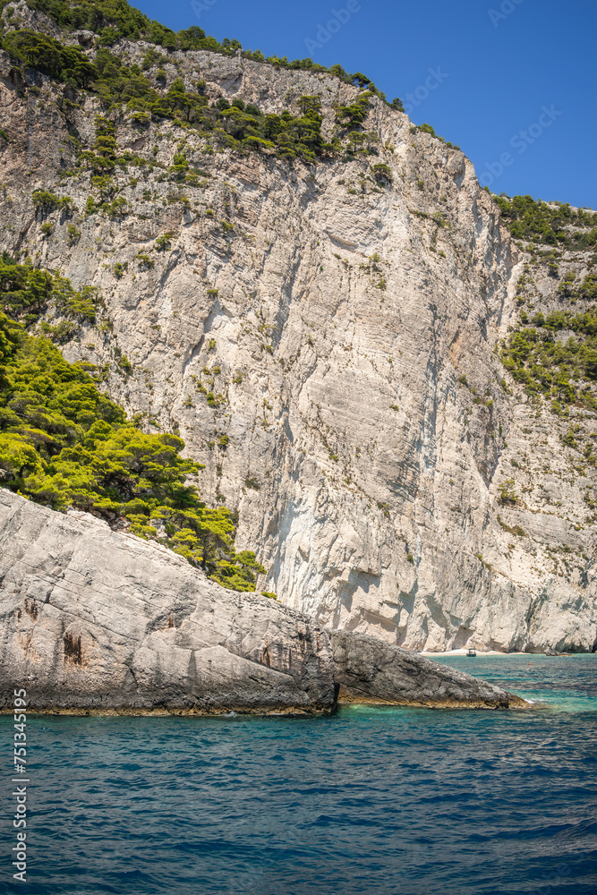 High Rocky Cliff with Turquoise Water in Zakynthos. Beautiful Scenery of Stone with Ionian Sea during Summer Day in Greece. High Rocky Cliff with Turquoise Water in Zakynthos. Beautiful Scenery of Stone with Ionian Sea during Summer Day in Greece.