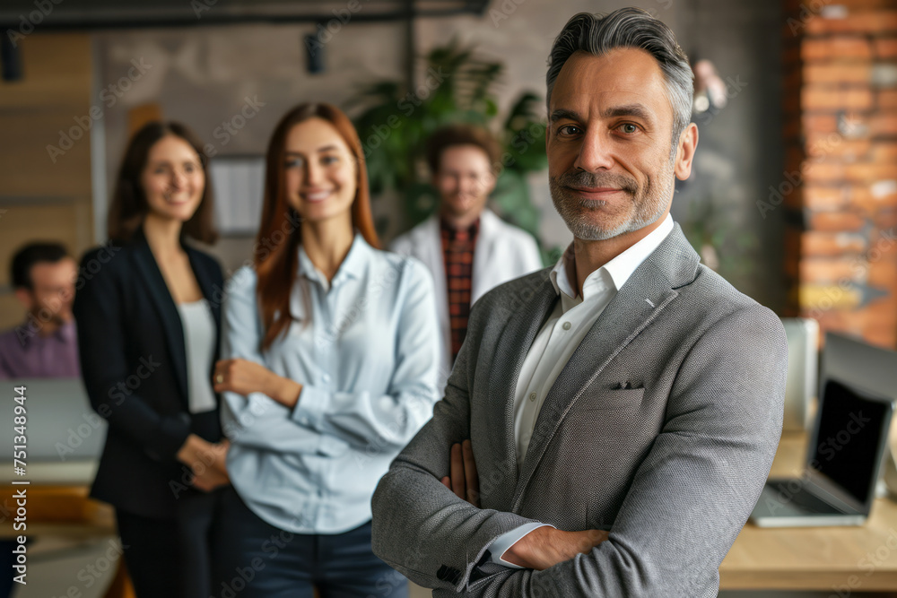 A diverse group of professionals standing together in a modern office environment A diverse group of professionals standing together in a modern office environment