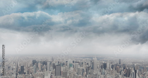 Image of cityscape and blue sky with clouds