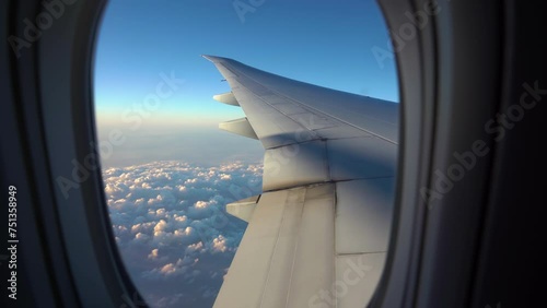 look of window plane Flying Over Stunning Clouds View. Travel and Vacation Airplane Passenger Seat View. 