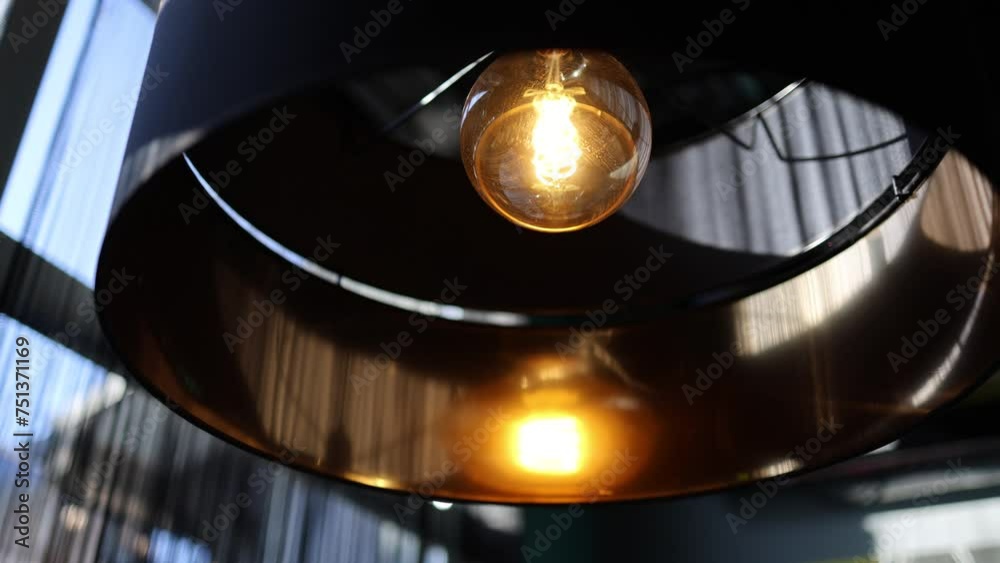 The video showcases a warm, ambient scene in a restaurant, featuring a beautiful decorative lamp emitting a soft, golden glow. The captivating light creates an inviting atmosphere. The video showcases a warm, ambient scene in a restaurant, featuring a beautiful decorative lamp emitting a soft, golden glow. The captivating light creates an inviting atmosphere.