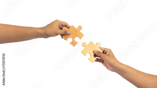 man holds in hand a jigsaw puzzle. Business solutions, success and strategy concept. partnership handshake, dealing, venture, merger and acquisition.isolated on white background