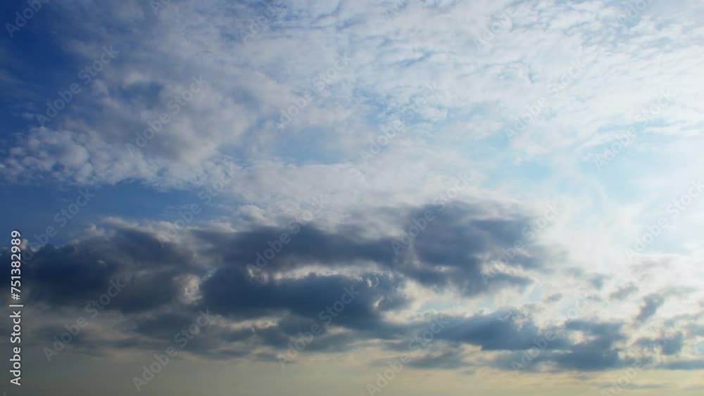Clouds at different heights move in different directions. An unusual atmospheric phenomenon. The sky at sunset with a pink tint. Clouds at different heights move in different directions. An unusual atmospheric phenomenon. The sky at sunset with a pink tint.