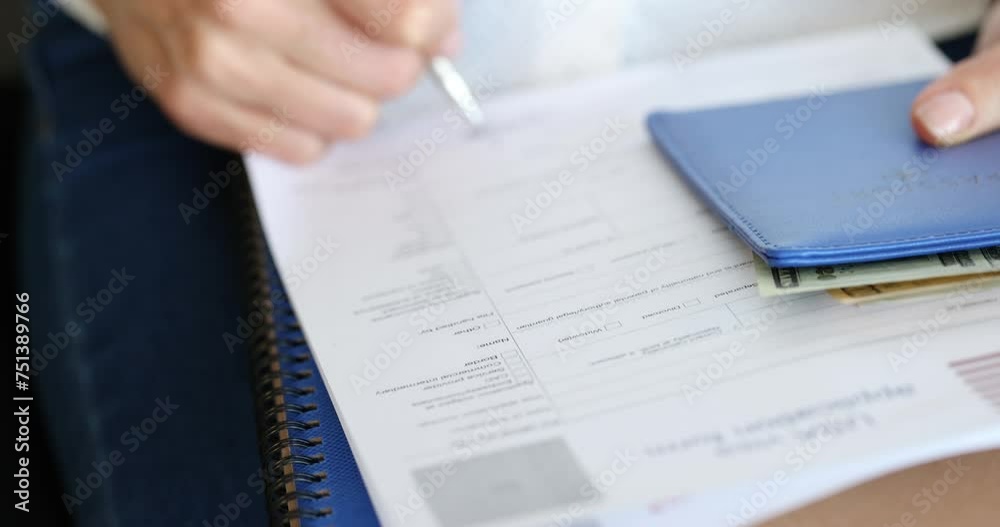 Person holds passport and fills out American visa application form. Getting an American visa concept Person holds passport and fills out American visa application form. Getting an American visa concept