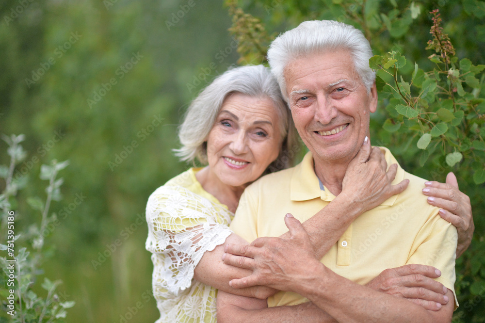 Portrait of happy elderly couple posing in park Portrait of happy elderly couple posing in park
