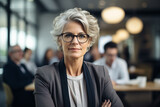 portrait of senior businesswoman looking at camera in the meeting room