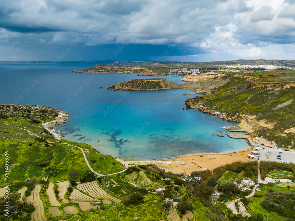 Aerial view of Gnejna Bay and sea, stormy sky. Maltese island