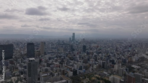 Wallpaper Mural Metropolis from height. Fly above buildings in urban borough in large city in flat landscape. Osaka, Japan Torontodigital.ca