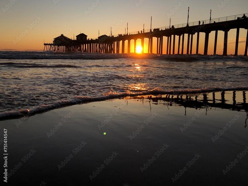 Sunrise at the beach by the pier