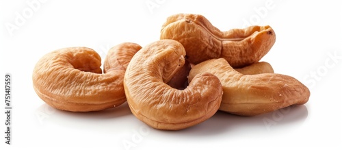 An assortment of various nuts neatly stacked on a clean white background