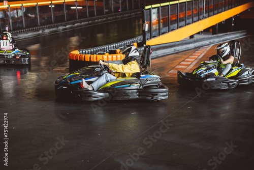 Go-Kart Racers group of young friends curve on circuit