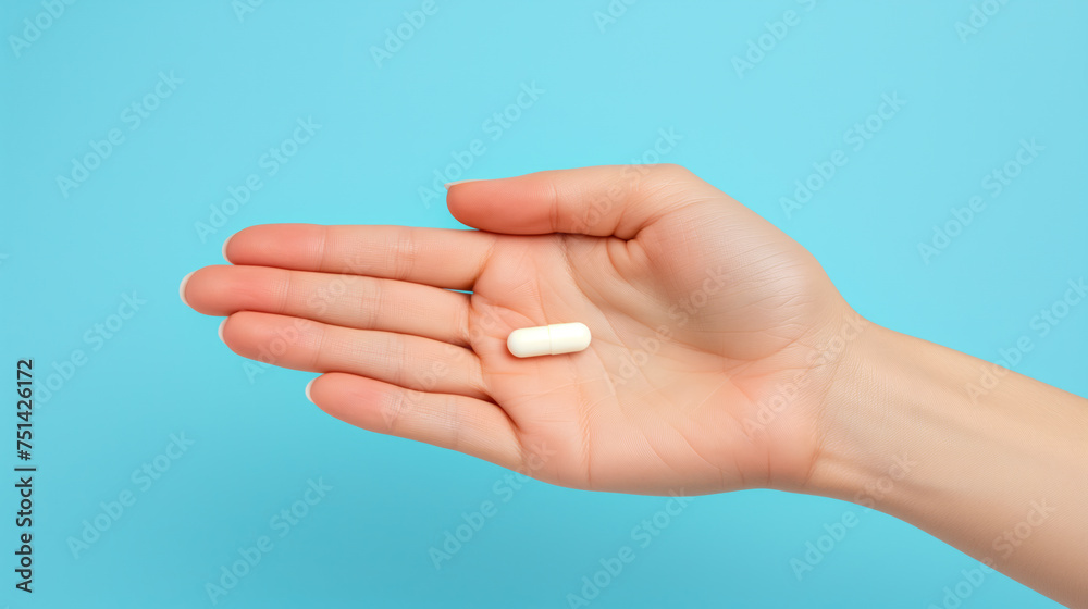 A hand holding two white capsules against a blue background. Ai generative illustration A hand holding two white capsules against a blue background. Ai generative illustration
