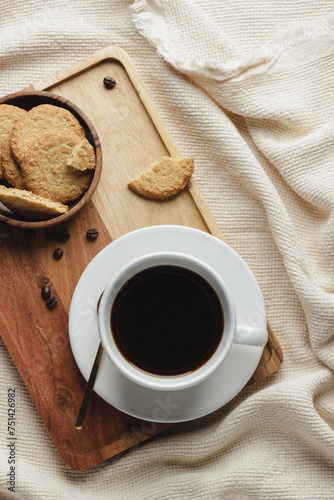 A cup of coffee with homemade cookies.