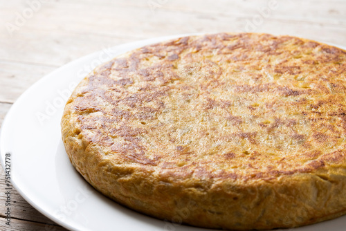 Traditional spanish omelette on wooden table.