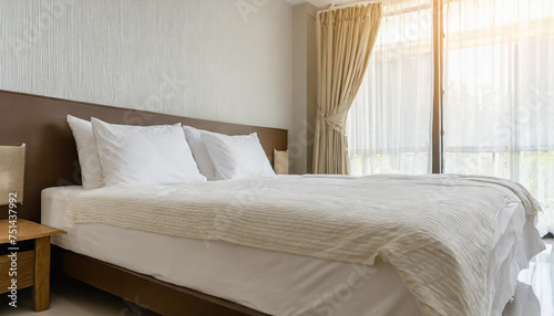 close up empty bed with pillows and blanket in the bedroom