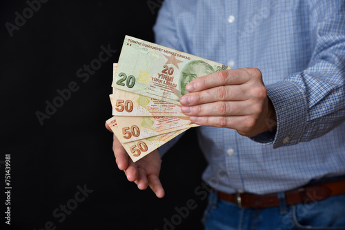 Businessman holding banknotes in his hand. Turkish lira cash. photo