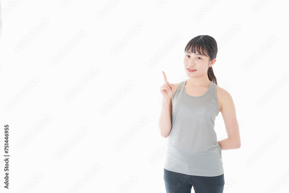 アドバイスをするスポーツウェアを着た若い女性