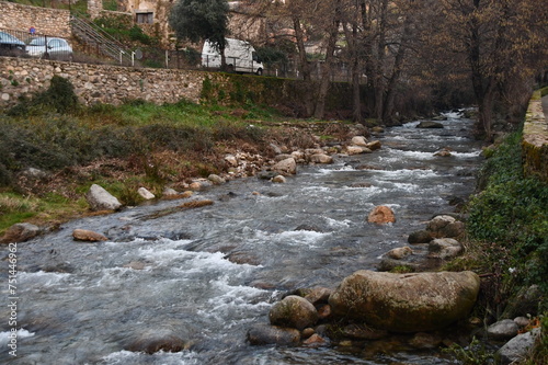 Flow of water from a river passing through a town