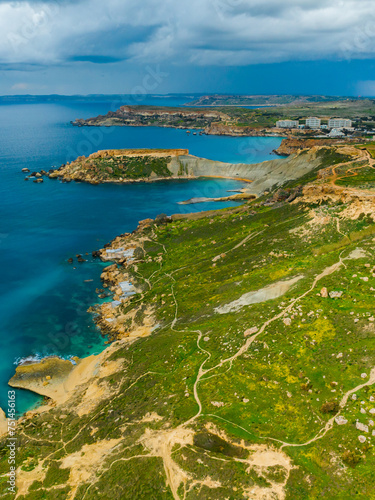 Aerial view of Gnejna Bay and sea, stormy sky. Malta 