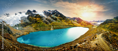 Beautiful landscape of the lagoon with sunset on the snowy Huaytapallana, Peru