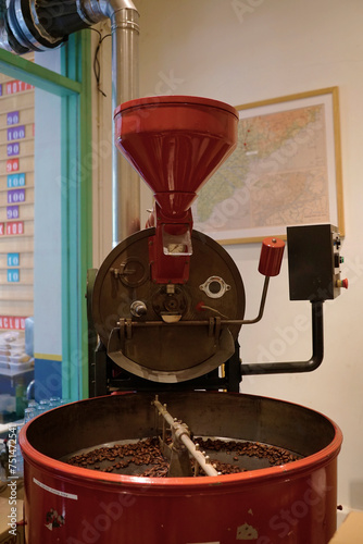 Cute red vintage coffee bean blender displayed in a coffee shop