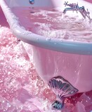 Pink bubble bath with sparkling water in a classic white bathtub, a luxurious bathroom concept