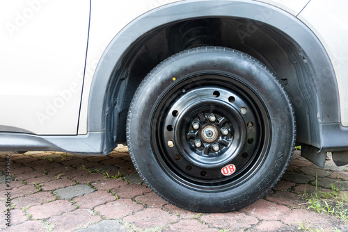 Temporary wheel installed on car automobile with maximum speed limit of 80 km per hour