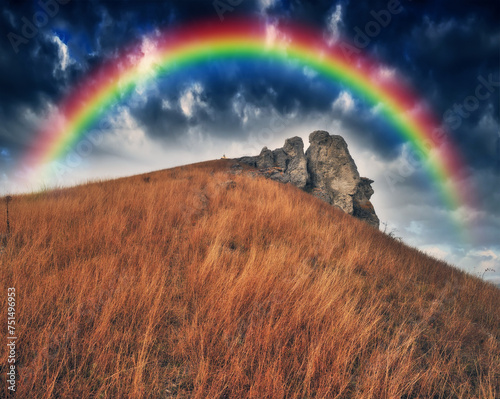 Rainbow with clouds over a rock. nature of Ukraine © sergnester
