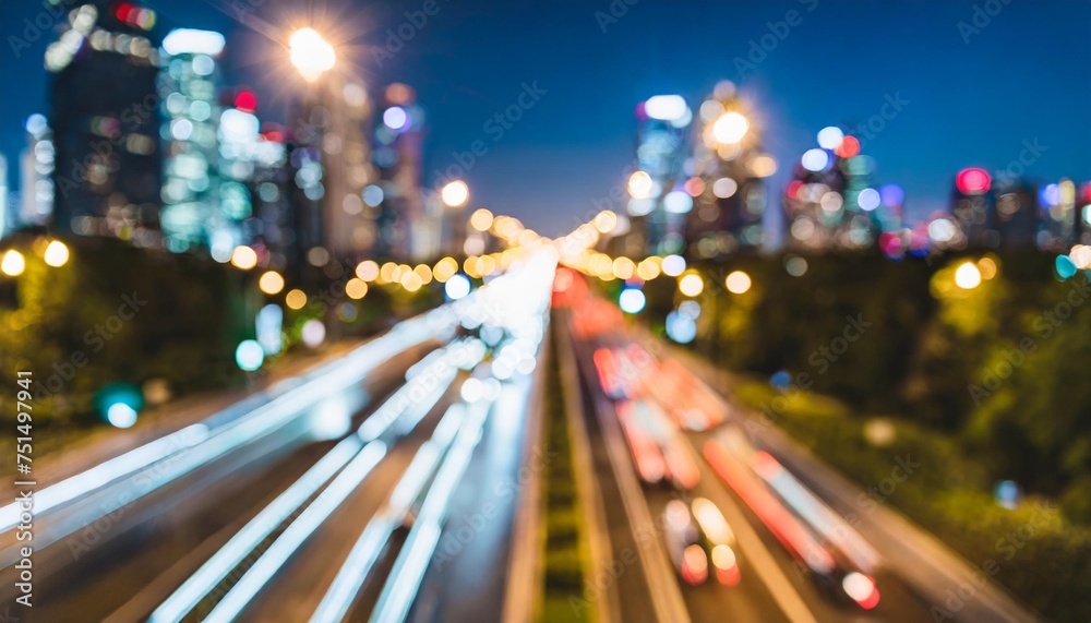 evening defocused view with bokeh lights of urban setting and moving cars on road in city district blurred background of transportation in metropolis downtown with copy space for advertise information