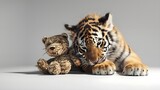 whiskered cuddles: a tiger cub's tender moment with its plush pal