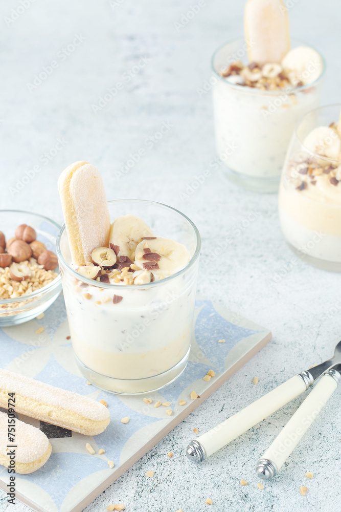 Milk mousse dessert with nuts in glasses Milk mousse dessert with nuts in glasses